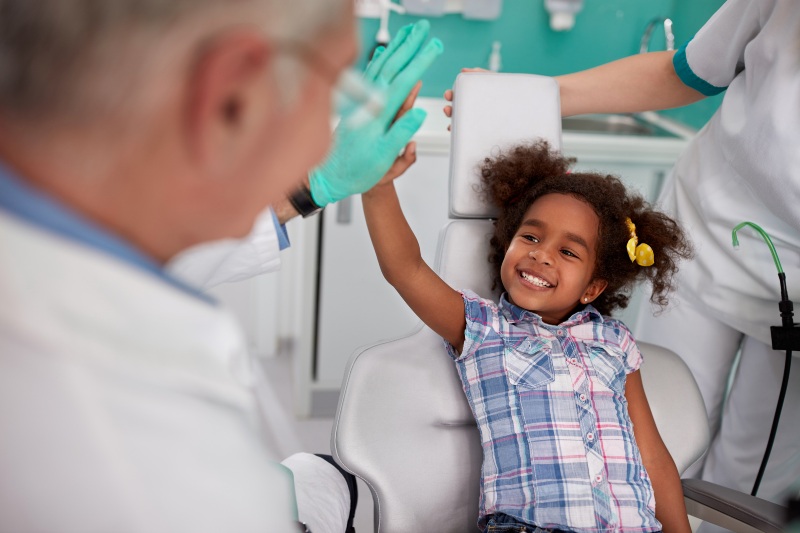 Young kid enjoying pediatric dentistry services in Phoenix, AZ